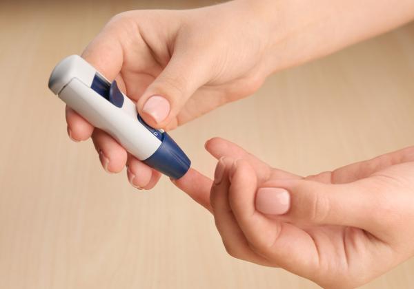 Woman doing diabetes test