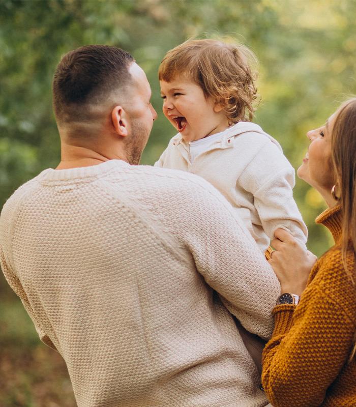 Young family at park in Autumn colours